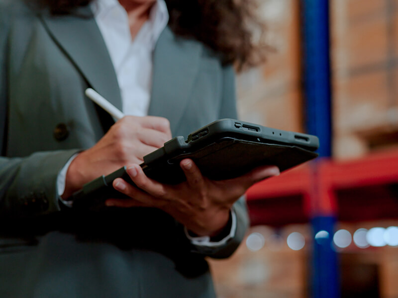 Woman auditing freight shipment in wareshouse 